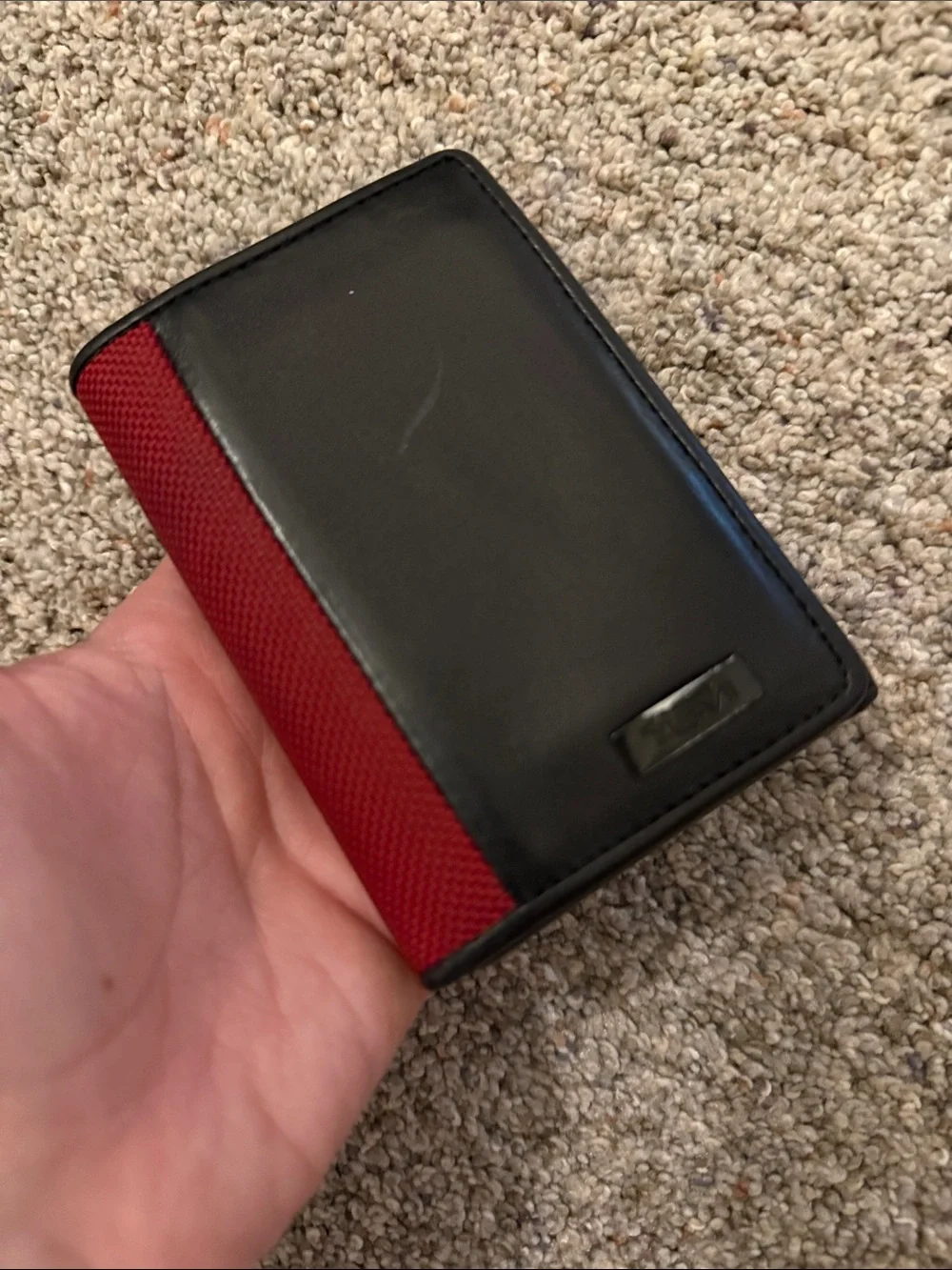 Tumi Black Leather Trifold Wallet with Red Fabric Trim